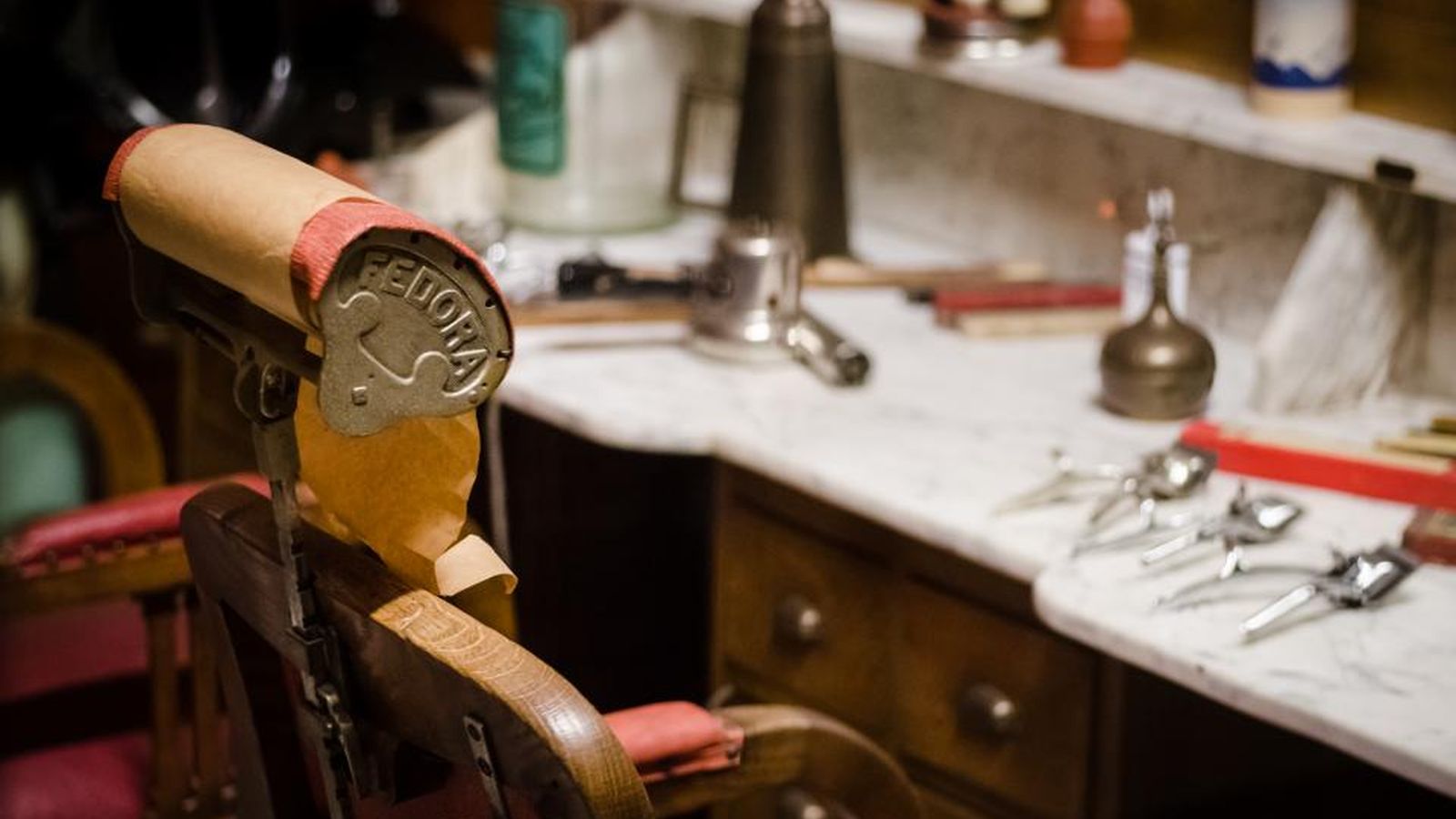 An empty barber's chair in a neighbourhood barbershop