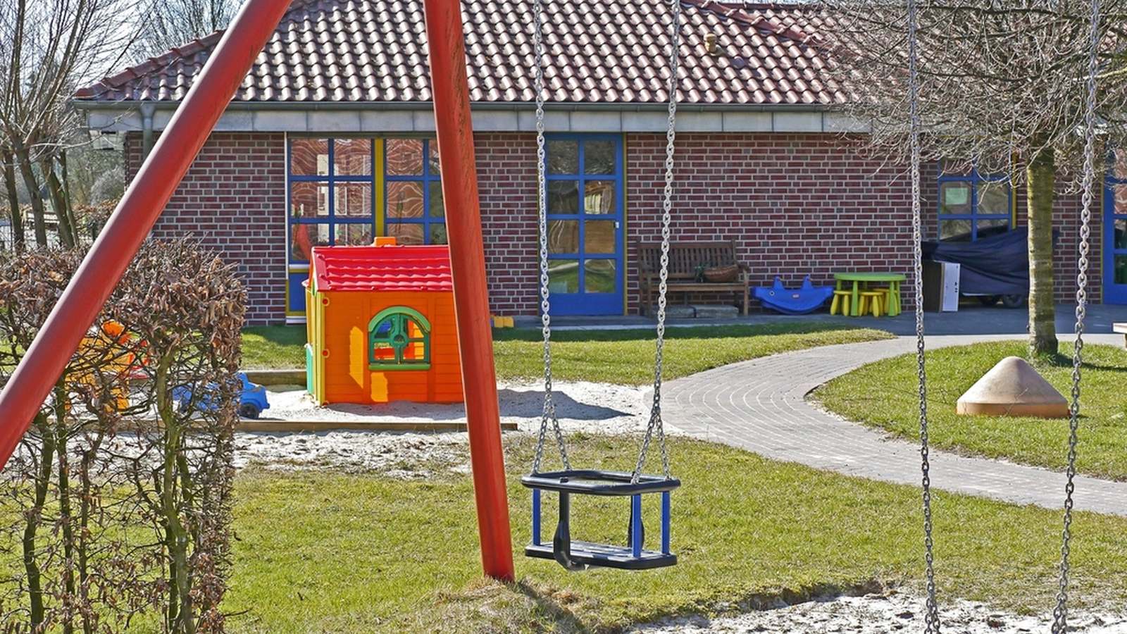 A swing in a back garden